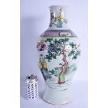 A LARGE 19TH CENTURY CHINESE FAMILLE ROSE PORCELAIN VASE Qing, painted with immortals within landsc