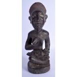 AN AFRICAN TRIBAL CARVED WOOD FERTILITY FIGURE modelled with glass eyes. 41 cm x 9 cm.