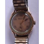 A VINTAGE 14CT ROLLED GOLD BULOVA PEACH DIAL WRISTWATCH. 2.75 cm wide.