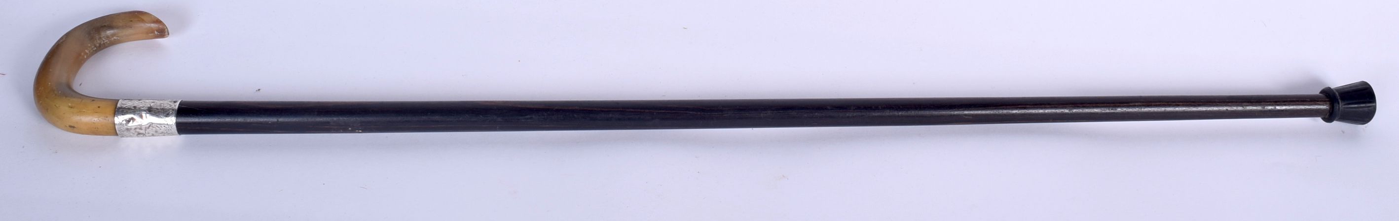 A 19TH CENTURY RHINOCEROS HORN HANDLED WALKING STICK, formed with a silver collar and lignum vitae - Image 2 of 2