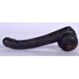 A LARGE CARVED STONE PENIS, formed with a slender shaft. 27 cm long.