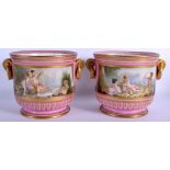 A PAIR OF 19TH CENTURY FRENCH PARIS SEVRES PORCELAIN ICE PAILS painted with landscapes and putti. 2