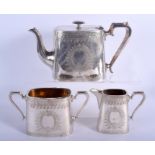 AN EDWARDIAN SILVER PLATED THREE PIECE TEASET. Largest 24 cm wide. (3)