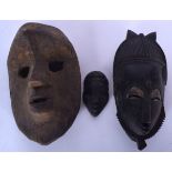 THREE AFRICAN CARVED WOODEN MASKS, varying form. Largest 23.5 cm x 14.5 cm. (3)