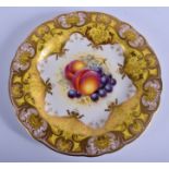 Royal Worcester plate painted with fruit under a pale yellow and gilt ground by J. Freeman signed,