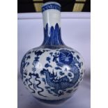 A HUGE CHINESE BLUE AND WHITE PORCELAIN VASE, decorated with dragons. 57 cm x 38 cm.