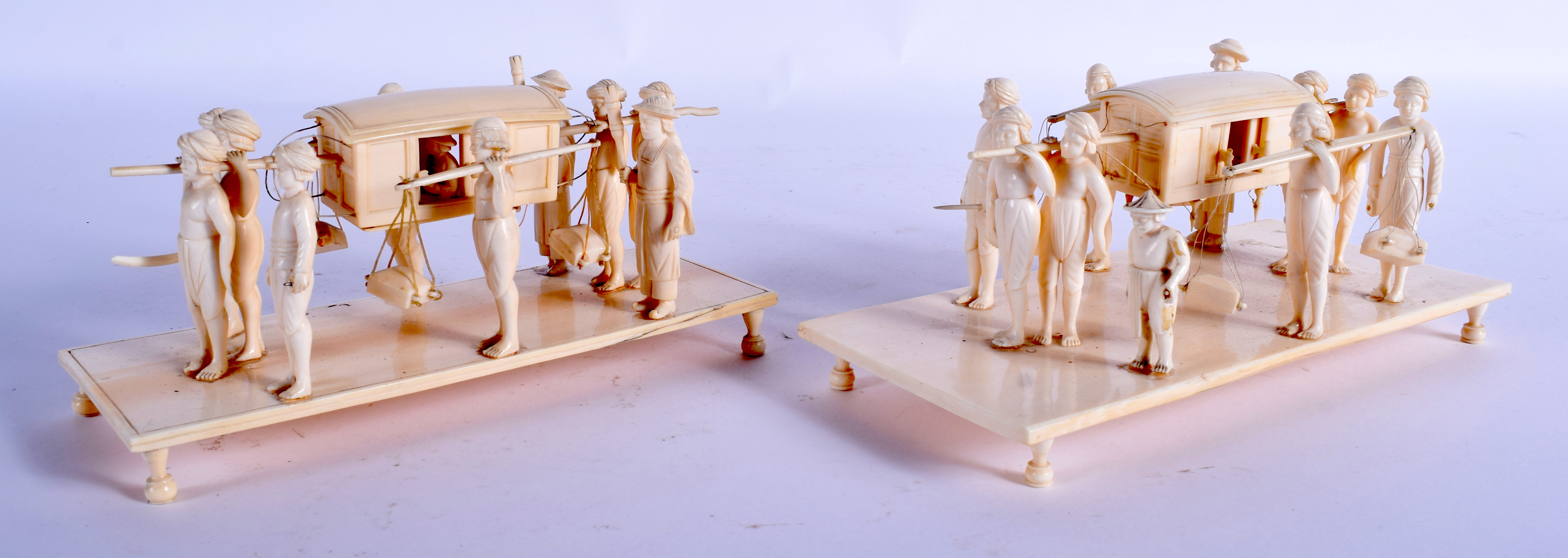 A PAIR 19TH CENTURY ANGLO INDIAN CARVED IVORY PROCESSION GROUPS modelled upon rectangular bases. 21