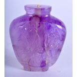 A 19TH CENTURY CHINESE CARVED AMETHYST SNUFF BOTTLE Qing, carved with Buddhistic deity. 5.5 cm x 4.