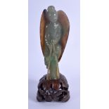 A FINE EARLY 20TH CENTURY CHINESE CARVED JADEITE FIGURE OF AN IMMORTAL modelled encased within a pa