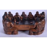 AN EARLY 20TH CENTURY RUSSIAN CARVED WOOD FIGURAL GROUP C1900 probably carved from persimmon. 36 cm