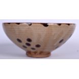 A CHINESE BROWN GLAZED BOWL, formed with a speckled decoration. 17 cm wide.
