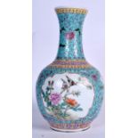 A CHINESE TURQUOISE GLAZED PORCELAIN VE, decorated with birds in panels. 35 cm high.