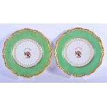 Early 19th c. Flight Barr and Barr Worcester pair of green ground plates with the crest of a bird