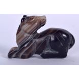 A CARVED AGATE FIGURAL PENDANT, in the form of a dog. 6.5 cm wide.