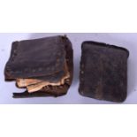 A LEATHER BOUND ISLAMIC MANUSCRIPT, together with another sealed case. 6 cm wide. (2)