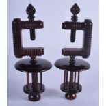 A PAIR OF ANTIQUE LIGNUM VITAE TREEN VICES. 15 cm x 6 cm.