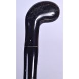 AN EARLY 20TH CENTURY BUFFALO HORN WALKING CANE, sectional and formed with a bulbous terminal. 85 c