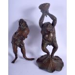 A PAIR OF 19TH CENTURY JAPANESE MEIJI PERIOD BRONZED LEAD FROGS modelled in various stances. 27 cm