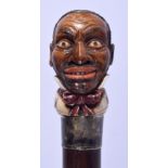 A VICTORIAN PAINTED IVORY SILVER MOUNTED BLACKAMOOR WALKING CANE modelled as a male in a bow tie. 8