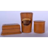 A MAUCHLINE WARE DICE SHAKER, together with a stamp box and another. Largest 7.5 cm high. (3)