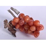 A CHINESE AGATE FRUIT GRAPE SCULPTURE, formed with a silver leaf. 11 cm long.