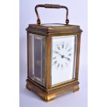 A LARGE ANTIQUE BRASS CARRIAGE CLOCK. 18.5 cm high inc handle.