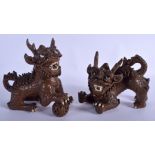 A PAIR OF EARLY 20TH CENTURY CHINESE YIXING POTTERY DOGS OF FOE. 20 cm x 18 cm.