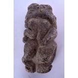 AN AFRICAN CARVED STONE SCULPTURE, formed as opposing figures. 23 cm x 11 cm.