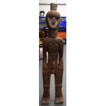 A LARGE AFRICAN CARVED LWALWA TYPE WOODEN STATUE, formed with an object protruding from his head. 1