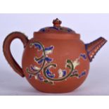 A EUROPEAN YIXING TYPE POTTERY TEA POT, enamelled with foliage. 14 cm wide.