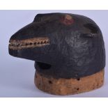 A WEST AFRICAN WOODEN MASK, in the form of a bear like creature. 27 cm x 35 cm.