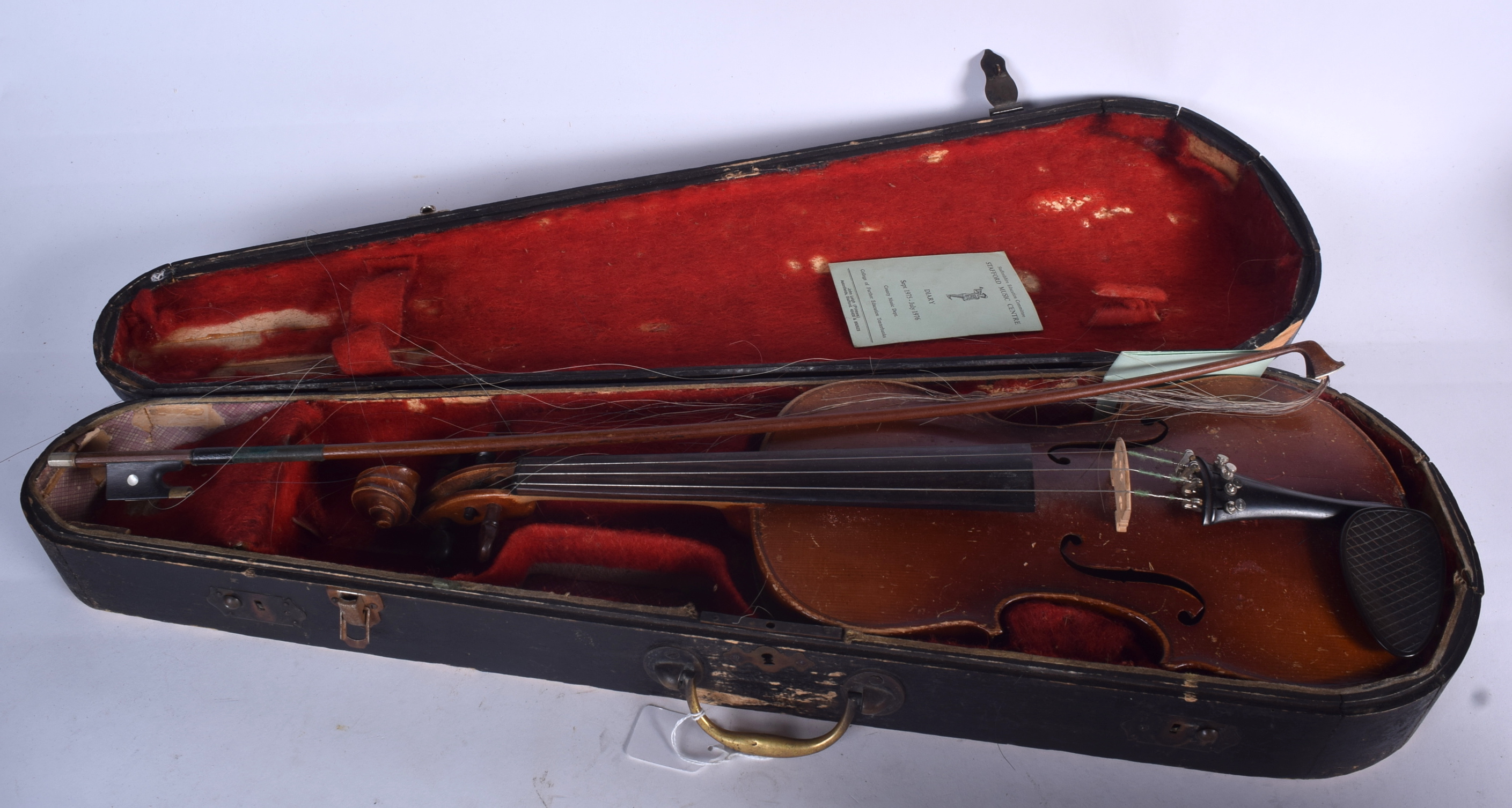 A CASED VIOLIN, together with associated bow. 59 cm long.