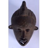 A BURKINA FASO BRONZE BOBO MASK, formed with entwined serpent decoration to face. 28.5 cm x 19 cm.