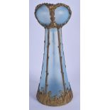 A FRENCH ART NOUVEAU BRASS OVERLAID OPAQUE BLUE VASE decorated with foliage. 31 cm high.