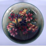 A MOORCROFT SPRING FLOWER CIRCULAR BOWL of large proportions. 31 cm diameter.