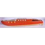 A VINTAGE WOODEN BOAT, painted red. 76 cm long.