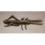 A JAPANESE BRONZE OKIMONO IN THE FORM OF A GRASSHOPPER, unsigned. 11.5 cm long.