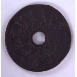 A CHINESE COIN, decorated calligraphy. 4.25 cm wide.