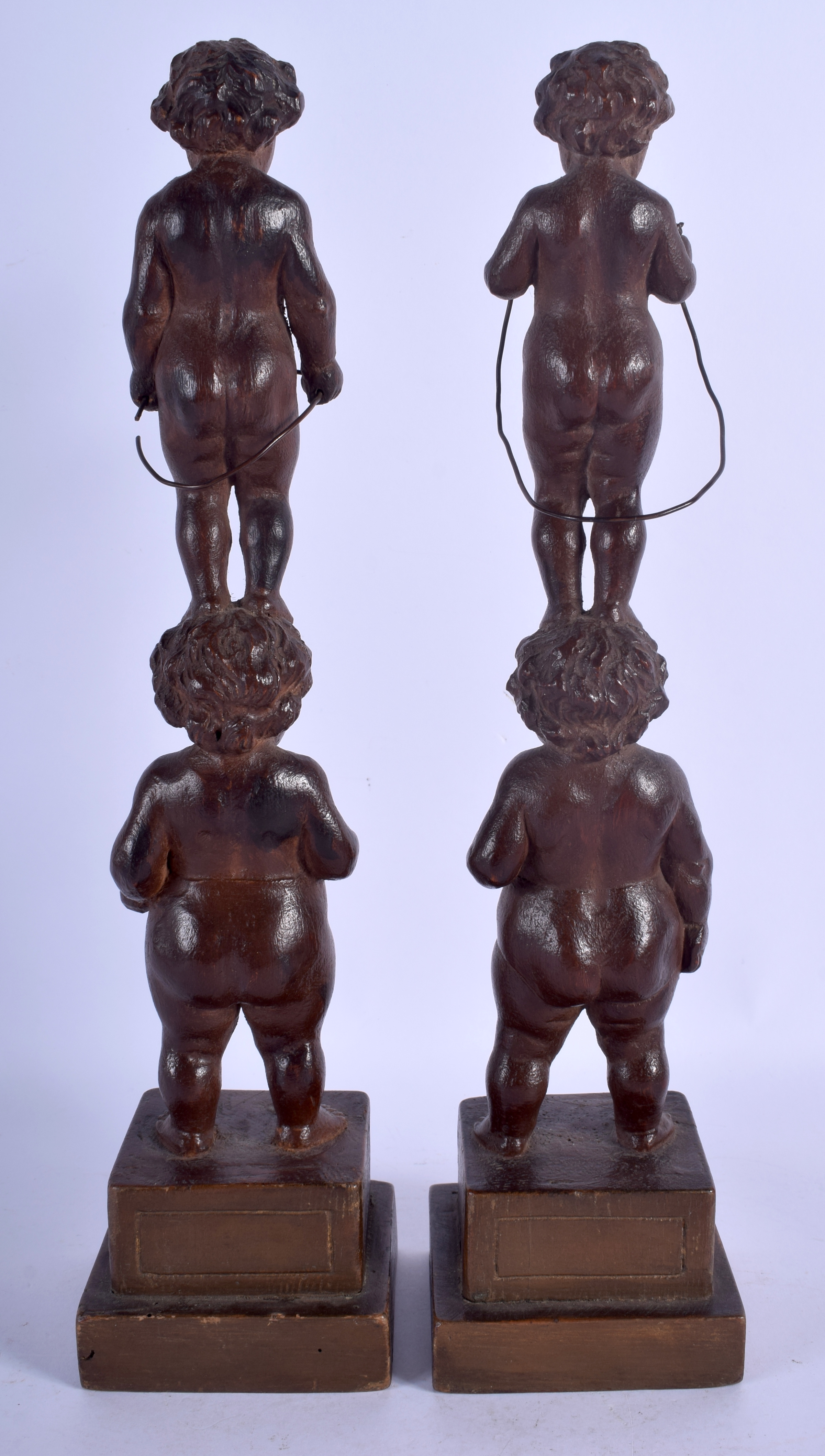 A PAIR OF 19TH CENTURY CONTINENTAL CARVED WOOD FIGURE OF PUTTI modelled upon square form bases. 35. - Image 3 of 3