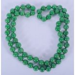 A CHINESE JADE SPHERICAL BEAD NECKLACE. 86 cm long.