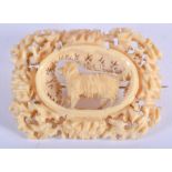 AN ANTIQUE CARVED IVORY BROOCH. 5 cm x 3 cm.