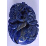 AN EARLY 20TH CENTURY CHINESE LAPIS LAZULI PENDANT, carved with a mythical beast. 5 cm x
