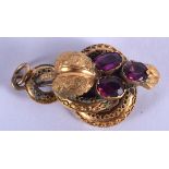 A VICTORIAN HIGH CARAT GOLD AND AMETHYST BROOCH. 3.9 grams. 3.5 cm x 2 cm.