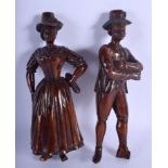 A PAIR OF 19TH CENTURY MIDDLE EUROPEAN CARVED TREEN FIGURES with fabulous patina. 23.5 cm high.