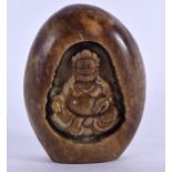 A 20TH CENTURY CHINESE CARVED HARDSTONE PEBBLE, depciting a seated mythcial figure. 9 cm x 6.75 cm.