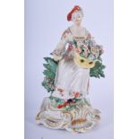 18TH C. DERBY RARE VERSION OF SPRING HOLDING A BASKET OF FLOWERS. 15cm high and 8cm wide