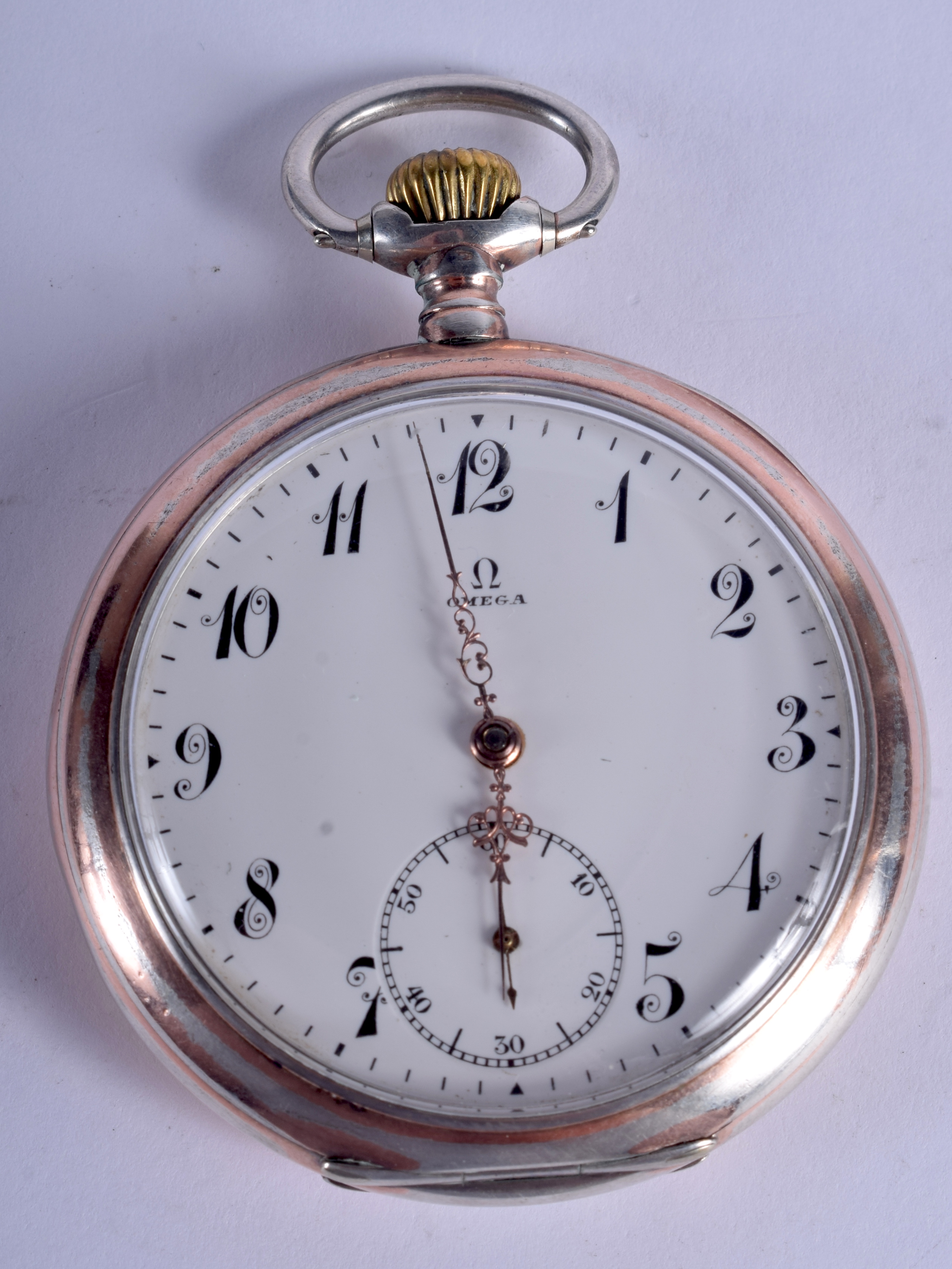 A SILVER OMEGA POCKET WATCH. 5 cm wide.