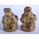 A PAIR OF 17TH/18TH CENTURY CHINESE LACQUERED STONE BUDDHISTIC LIONS Ming/Qing, decorated with green