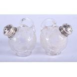 A PAIR VINTAGE SILVER TOPPED GLASS SALTS. 6 cm x 8 cm.