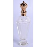 AN ANTIQUE FRENCH GOLD SCENT BOTTLE. 10 cm high.